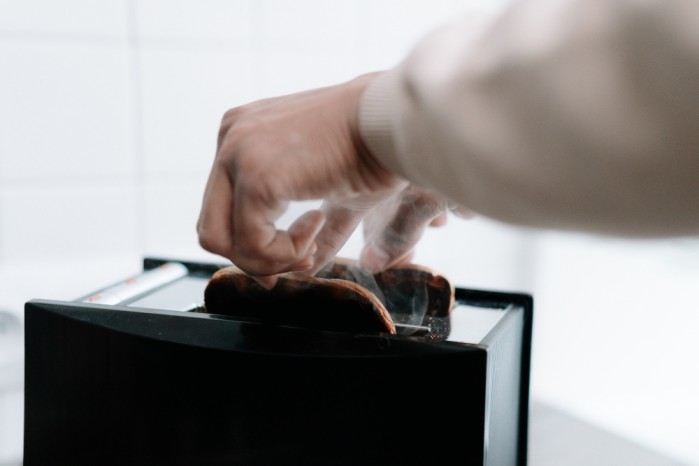 Burning toast in a kitchen